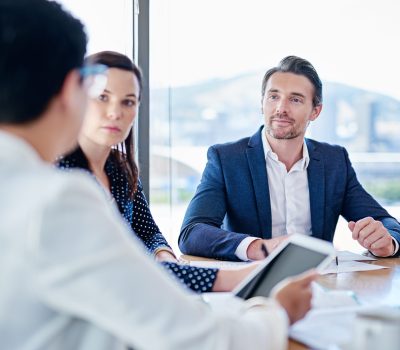 Cropped shot of corporate businesspeople meeting in the boardroom.
